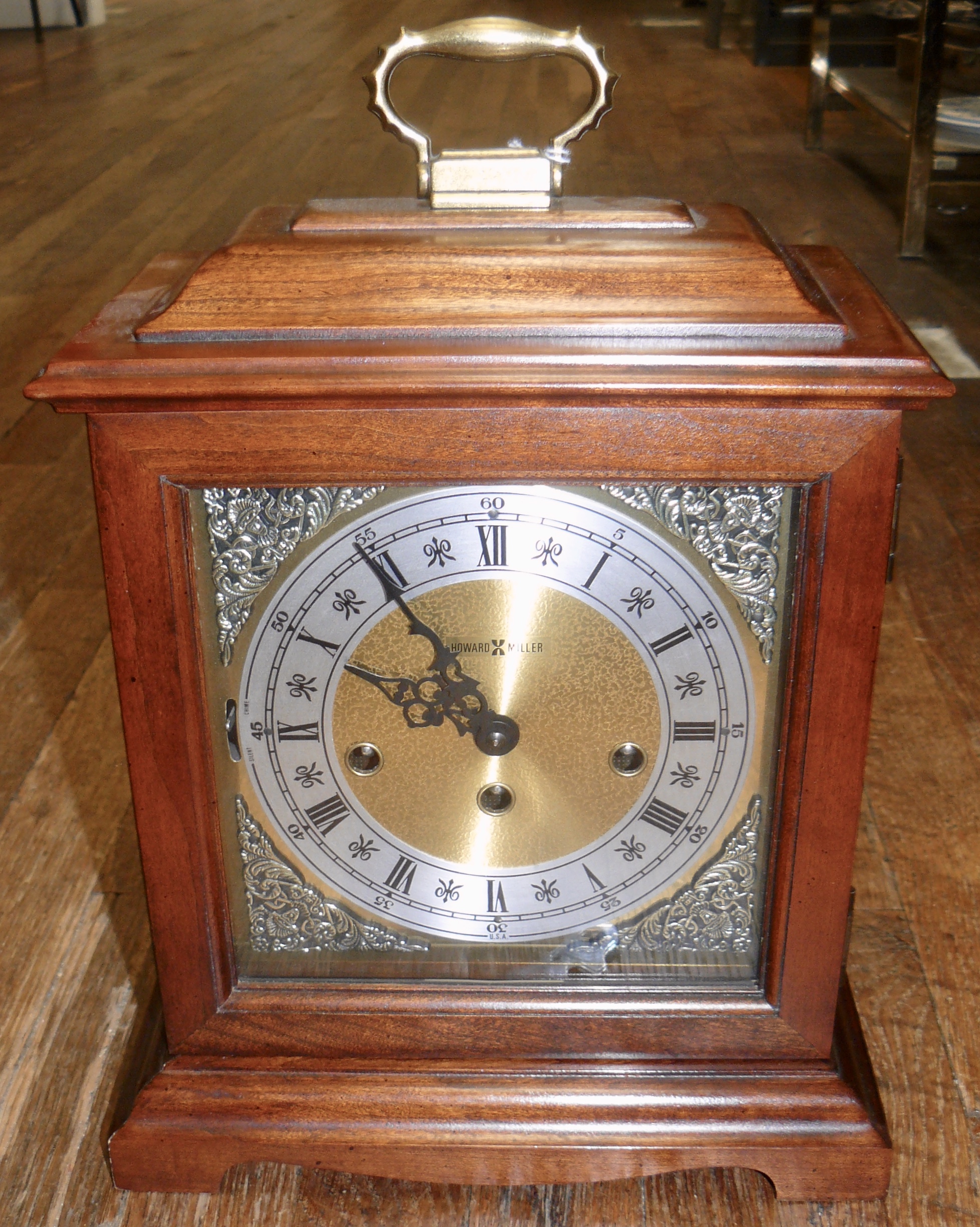 A Howard Miller Mantel Clock, A Huge Hand Carved Swan and an Old Folk